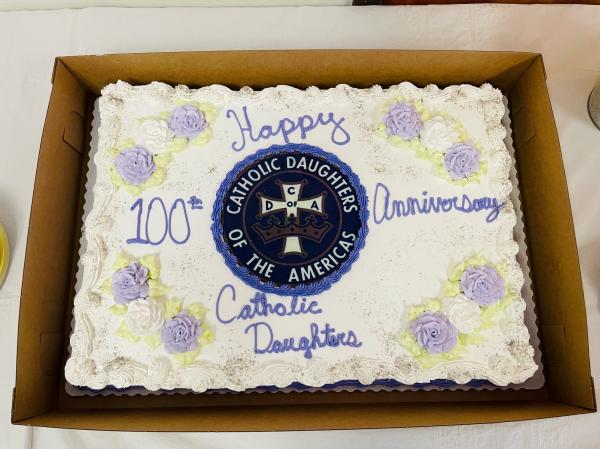 A special cake commemorating the 100th anniversary was shared after a delicious meal.